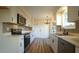 Modern kitchen with white cabinets and quartz countertops at 300 Worth St, Raleigh, NC 27601