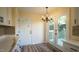 Eat-in kitchen with French doors leading to a deck and updated finishes at 300 Worth St, Raleigh, NC 27601