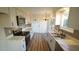 Bright kitchen features white cabinets, stainless steel appliances, and quartz countertops at 300 Worth St, Raleigh, NC 27601