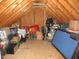 Unfinished attic space with storage and pool table at 35 Meadow Ln, Franklinton, NC 27525