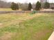 Large backyard with grassy area and playset at 35 Meadow Ln, Franklinton, NC 27525