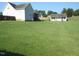 A large, lush backyard provides plenty of space for outdoor activities at 35 Meadow Ln, Franklinton, NC 27525