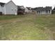 View of large backyard, detached shop, and home at 35 Meadow Ln, Franklinton, NC 27525