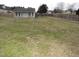 Large backyard with detached workshop and firepit at 35 Meadow Ln, Franklinton, NC 27525