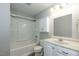 Clean bathroom with shower/tub combo, vanity, and built-in shelving at 35 Meadow Ln, Franklinton, NC 27525