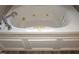 Close-up view of a clean jetted bathtub at 35 Meadow Ln, Franklinton, NC 27525