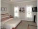 Spacious bedroom with a king-size bed, large windows, and a sitting area at 35 Meadow Ln, Franklinton, NC 27525