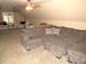 Spacious bonus room with large sectional sofa and lots of natural light at 35 Meadow Ln, Franklinton, NC 27525
