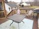 Wooden deck with patio table, chairs, and grill at 35 Meadow Ln, Franklinton, NC 27525