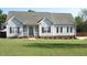 Attractive single-story home with a well-kept lawn, inviting porch, and traditional architectural design at 35 Meadow Ln, Franklinton, NC 27525