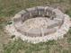 Brick fire pit with gravel base in the backyard at 35 Meadow Ln, Franklinton, NC 27525