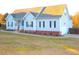 Charming single-story home with light blue siding and a well-manicured front lawn at 35 Meadow Ln, Franklinton, NC 27525