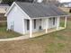 Detached guest house with covered porch at 35 Meadow Ln, Franklinton, NC 27525