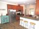 Open concept kitchen with stainless steel appliances and granite countertops with bar stool seating at 35 Meadow Ln, Franklinton, NC 27525