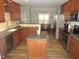 Open kitchen with an island, stainless steel appliances, and view to dining at 35 Meadow Ln, Franklinton, NC 27525