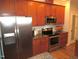 Modern kitchen with stainless steel appliances and wood cabinets at 35 Meadow Ln, Franklinton, NC 27525