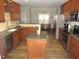 Kitchen with granite countertops, wood cabinets, and an island at 35 Meadow Ln, Franklinton, NC 27525