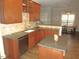 Modern kitchen with granite countertops and stainless steel appliances at 35 Meadow Ln, Franklinton, NC 27525
