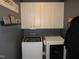 Bright laundry room features washer, dryer, and ample storage cabinets at 35 Meadow Ln, Franklinton, NC 27525