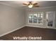 Spacious living room with hardwood floors, a ceiling fan, and bright natural light at 35 Meadow Ln, Franklinton, NC 27525
