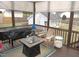Relaxing screened porch with fire pit and outdoor seating at 35 Meadow Ln, Franklinton, NC 27525