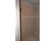 Walk-in shower featuring neutral tile walls and a built-in seat, creating a spa-like experience at 35 Meadow Ln, Franklinton, NC 27525