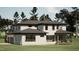 Spacious backyard view featuring modern home with a covered patio perfect for outdoor living and entertaining at 403 Carolyn Ct, Cary, NC 27511