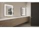 Stylish bathroom featuring double sinks, modern vanity lighting, and sleek design elements at 403 Carolyn Ct, Cary, NC 27511