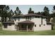 This modern home boasts a covered deck perfect for entertaining and is surrounded by towering mature trees at 403 Carolyn Ct, Cary, NC 27511