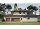 Beautiful home featuring a three-car garage, complemented by lush greenery and a well-maintained lawn at 403 Carolyn Ct, Cary, NC 27511