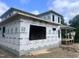 New construction home with Sagebuilt wrap showcases a modern design with framed windows and a covered porch at 403 Carolyn Ct, Cary, NC 27511