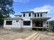 New construction home with modern architecture featuring Sagebuilt wrap, framed windows and large covered porch at 403 Carolyn Ct, Cary, NC 27511