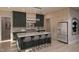 Stunning kitchen featuring a large island with bar seating, modern appliances, and ample cabinet space at 403 Carolyn Ct, Cary, NC 27511