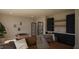 Inviting living room featuring a comfortable couch, foosball table, and a sleek wet bar for entertaining guests at 403 Carolyn Ct, Cary, NC 27511