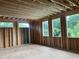 Spacious living room with wooden framing and ample natural light shining through newly installed windows at 403 Carolyn Ct, Cary, NC 27511