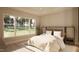 Inviting main bedroom with a king-sized bed, large windows, and a calming view of the outdoors at 403 Carolyn Ct, Cary, NC 27511