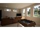 Entertainment room with a foosball table, large sectional sofa, and natural light at 403 Carolyn Ct, Cary, NC 27511