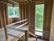 Home under construction shows a stairway framed with exterior view through the window at 403 Carolyn Ct, Cary, NC 27511