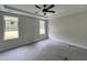 Bright bedroom with tray ceilings and lots of natural light, ready for personalization at 404 Brodie Rose Landing Way, Smithfield, NC 27577