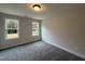 This bedroom is light and airy with two windows overlooking the property at 404 Brodie Rose Landing Way, Smithfield, NC 27577