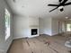 Inviting living room with a modern fireplace, awaiting your personal touch at 404 Brodie Rose Landing Way, Smithfield, NC 27577