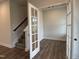 Home office space adjacent to staircase entrance provides extra space and natural lighting at 404 Brodie Rose Landing Way, Smithfield, NC 27577