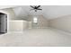 Bright attic with natural light, ceiling fan and staircase access to other floors at 541 Delma Grimes Rd, Coats, NC 27521