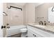 Stylish bathroom with a tub, a modern vanity with granite counters, and brushed bronze hardware at 541 Delma Grimes Rd, Coats, NC 27521