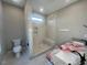A modern bathroom with a walk-in shower and marble counter tops at 541 Delma Grimes Rd, Coats, NC 27521