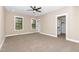 Spacious bedroom with carpet floors, recessed lighting, closet, and windows at 541 Delma Grimes Rd, Coats, NC 27521