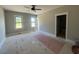 An unfinished bedroom with natural light coming in through windows at 541 Delma Grimes Rd, Coats, NC 27521