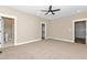 Spacious bedroom with carpet floors, recessed lighting, closet, and bathroom access at 541 Delma Grimes Rd, Coats, NC 27521