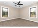 Neutral bedroom featuring carpet floors, recessed lighting, a ceiling fan, and windows at 541 Delma Grimes Rd, Coats, NC 27521