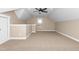 Spacious bonus room with carpeted floors, a ceiling fan, and a window offering natural light at 541 Delma Grimes Rd, Coats, NC 27521
